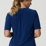 It's fluid drape and soft feel make it a versatile piece that effortlessly transitions from work wear to casual wear. Shop women's workwear basics and essentials in sizes 8-24. Easy care blouse features elbow length sleeves, tailored details and shirt tail hem.