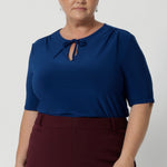 Featuring elbow-length sleeves, this top provides just the right amount of coverage while maintaining a relaxed and chic look. The stitching detail around the front-facing, complemented by thin fabric neckties, adds a tailored touch, perfect for elevating your everyday outfits. 