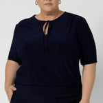  The stitching detail around the front-facing adds a touch of refined interest, while the thin fabric ties give you the option to tie them for a more structured look or leave them undone for a relaxed, flowing appearance.