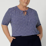 The stitching detail around the front-facing adds a touch of refined interest, while the thin fabric ties give you the option to tie them for a more structured look or leave them undone for a relaxed fit. Sleeved top in sizes 8-24.