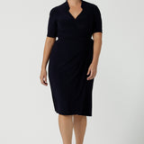 Kade dress in Navy is a functioning wrap dress in navy. Featuring a mandarin collar and short sleeves. Gathered at the waist with a functioning tie. Made in Australia for women size 8 - 24.