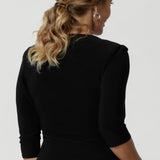 Back view image of soft wrap top made in Australia for women size 8-24. The perfect work to weekend top in comfortable and easy care jersey. Peplum top works perfectly with pants and skirts to create effortless workwear styling. 