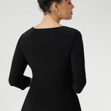 Back view image of fixed wrap top made in Australia for women size 8-24. The perfect work to weekend top in comfortable and easy care jersey. Peplum top works perfectly with pants and skirts to create effortless workwear styling. 