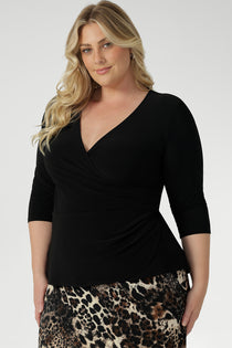 This top features a fixed wrap bodice that stays in place, offering the elegance of a wrap design without the hassle of constant readjusting. Whether you're at the office or heading to an after-work event, the Kyle Top provides effortless style and confidence. 