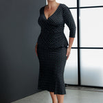 This versatile midi skirt is the perfect addition to any wardrobe, ideal for work, travel, or casual wear. Made from printed navy dry-touch fabric. Size 18 woman wears her Asher Skirt with matching Kyle Top in Midnight Mosaic for a sleek, feminine fit dress like style. Crafted from easy-care, wrinkle-resistant dry-touch jersey, this skirt is designed for all-day comfort and effortless styling.