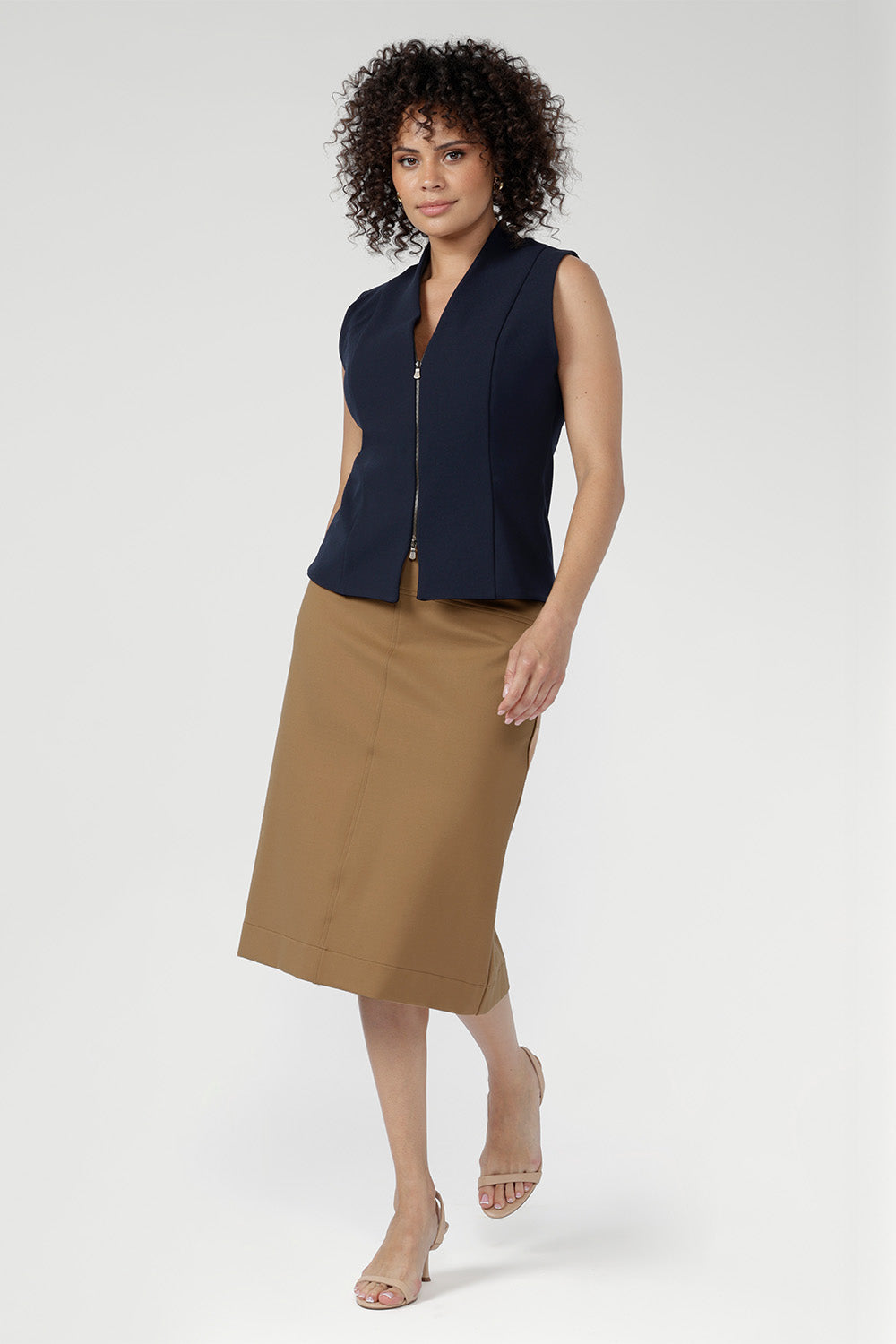 Introducing the new Landry Skirt, a refined addition to your wardrobe, expertly crafted from a caramel ponte fabric. 