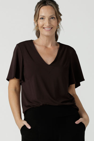 Women's breathable bamboo top for petite to plus size curvy women size 8-24. Ladies top for comfortable corporate wear. Featuring a flutter sleeve, V-neckline and curved hemline. 