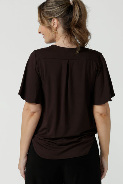Back view of women's breathable bamboo top for petite to plus size curvy women size 8-24. Ladies top for comfortable corporate wear. Featuring a flutter sleeve, V-neckline and curved hemline. 