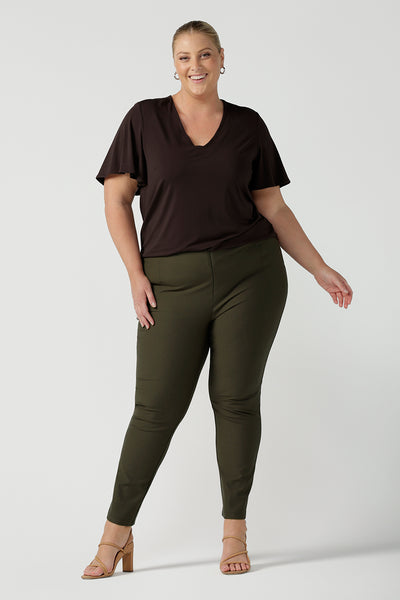 Women's breathable bamboo top for petite to plus size curvy women size 8-24. Ladies top for comfortable corporate wear. Featuring a flutter sleeve, V-neckline and curved hemline. Pictured on a size 18
