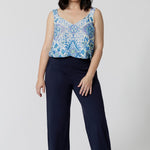Showing good lounge pants for petite women, a size 10 woman wears straight, wide leg navy blue, plus size lounge pants in bamboo jersey with a blue and white print modal cami top. Breathable and thermo-regulating this is a good pyjama set  for night sweats and hot flushes. Stay cool for summer nights with breathable sleepwear by L&F Australia in sizes 8-24.
