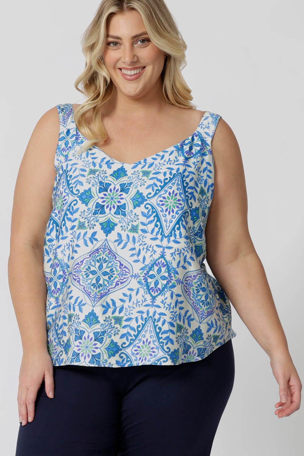 A good sleep  and loungewear top for plus size women, a size 18 woman wears this blue ,white and green print cami top with wide shoulder straps. In eco-friendly modal fabric this top is brathebal and thermo regulating and a good top for night  sweats. Create the perfect pajama set with this cami top and matching pyjama bottoms for women. 