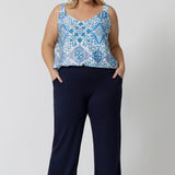 A good sleep and loungewear top for plus size women, a size 18 woman wears this blue ,white and green print cami top with wide shoulder straps. In eco-friendly modal fabric this top is breathable and thermo regulating and a good top for night  sweats. Creating the perfect pajama set, wear this cami top with bamboo jersey lounge pants.