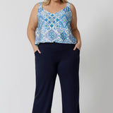 Showing good lounge pants for curvy women, a size 18 wears straight, wide leg navy blue, plus size lounge pants in bamboo jersey with a blue and white print modal cami top. Breathable and thermo-regulating this is a good pyjama set  for night sweats and hot flushes. Stay cool this summer nights with breathable sleepwear by L&F Australia.