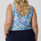 Back view of a good sleep and loungewear top for plus size women, a size 18 woman wears this blue ,white and green print cami top with wide shoulder straps. In eco-friendly modal fabric this pyjama top is breathable and thermo regulating and a good top for night  sweats. Create the perfect pajama set with this cami top and matching pyjama bottoms for women. 