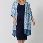 Worn with a blue and white print women's dressing gown , this navy blue lounge dress works as a nightdress and as loungewear. Shown on a size 18 woman, this slim-fit, plus size midi-dress in navy blue bamboo jersey is breathable and thermo-regulating. A good dress for night sweats and hot flushes, wear this as a summer dress for warm summer days. Shop nightdresses in women's clothes brand, L&F's new loungewear and sleepwear range online in sizes 8 to 24.