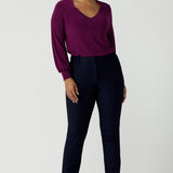 Lulu tailored pant in Navy. Made in Australia for women. Made in Australia for women size 8 - 24. A tailored pant in Navy with waistband and fly front with pockets. Styled back with the Avery top in Magenta. Proudly made in Australia. 