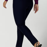 Lulu tailored pant in Navy. Made in Australia for women size 8 - 24. Made in Australia for women size 8 - 24. A tailored pant in Navy with waistband and fly front with pockets. Styled back with the Avery top in Magenta. Size 8 - 24 .