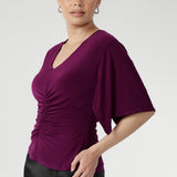The Luna Top is expertly crafted from our signature dry-touch stretch jersey, offering a perfect balance of professional style and all-day comfort. This elegant top features a flattering V-neckline that adds a touch of sophistication, while the unique handkerchief sleeves bring a modern, feminine edge to your wardrobe.