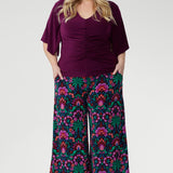 Designed with subtle bust darts for enhanced fit and a clean straight hemline for a polished silhouette, the Luna Top is a versatile staple for any work-to-weekend wardrobe. Plus size model wears her Luna Top with printed culottes.