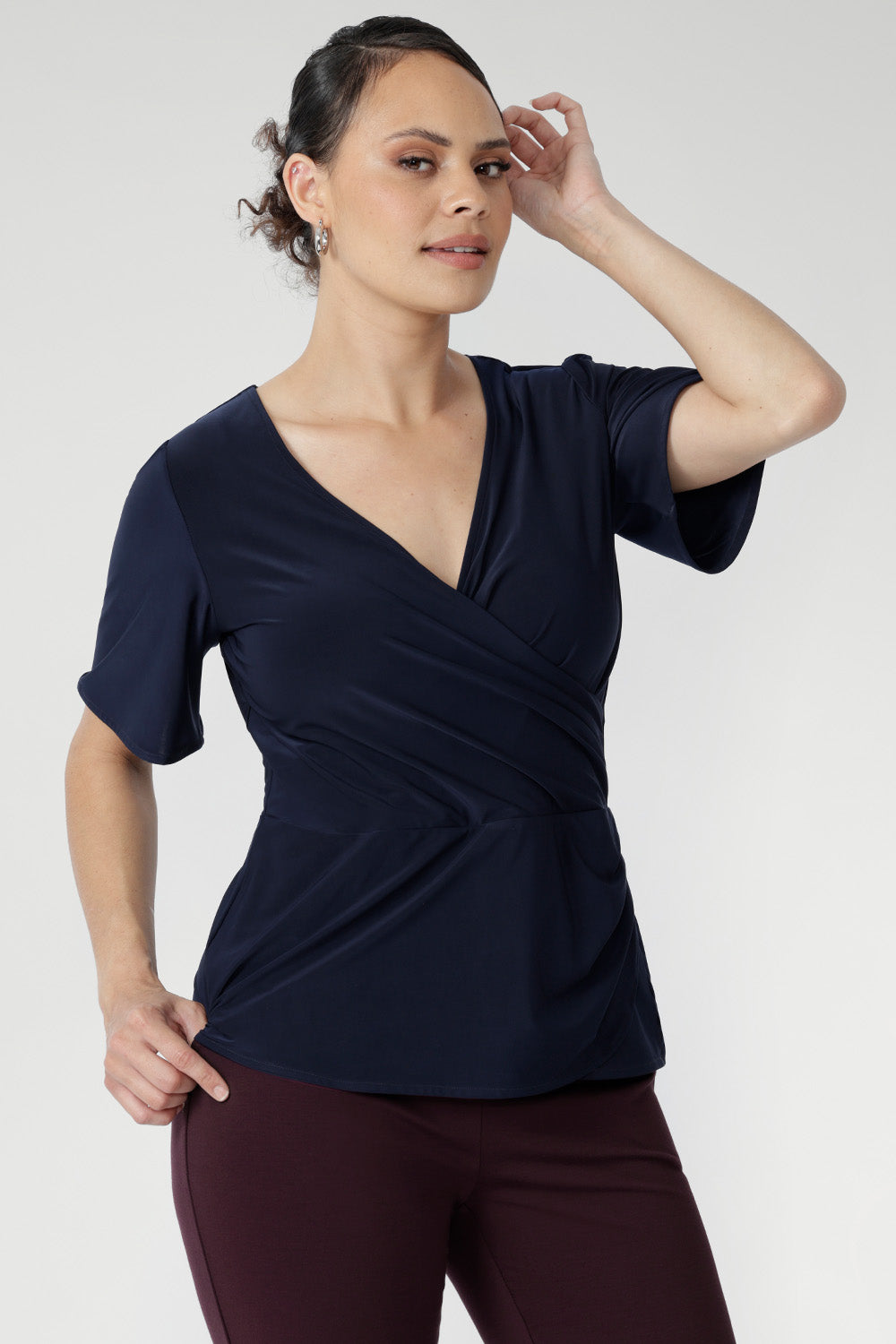  With short sleeves and a versatile silhouette, it layers effortlessly under jackets or stands alone as a polished summer essential.