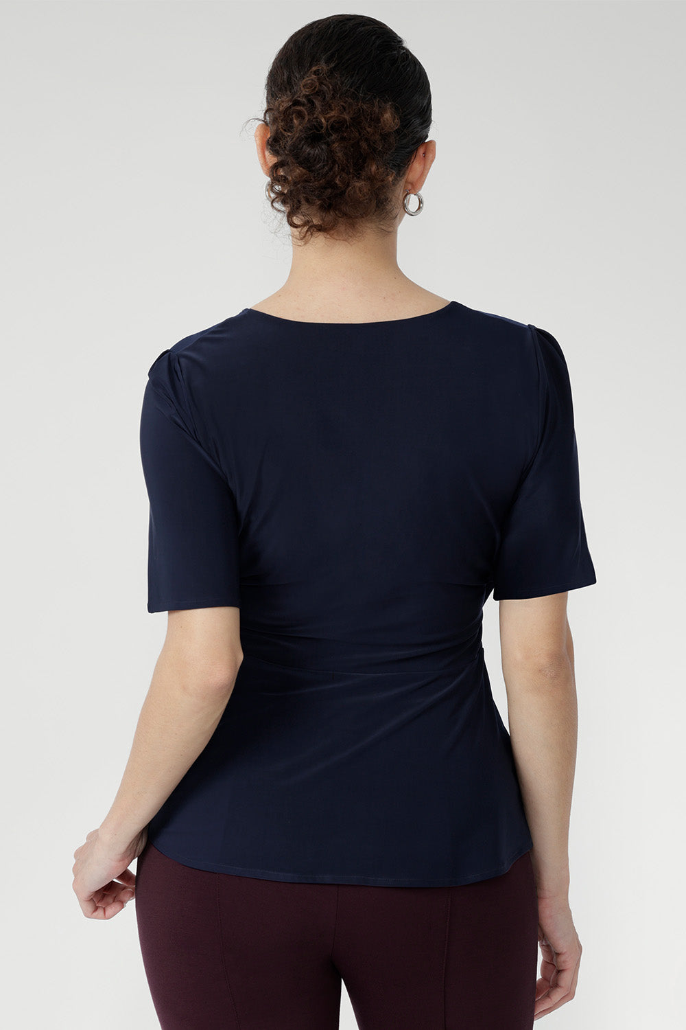 The Lyle Top layers effortlessly under jackets or stands alone as a polished summer essential.