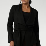 Lyndon features a double-layer jacket with   angled front panels for a modern edge and a detachable waist tie with belt loops, allowing you to wear it open or cinched to define your silhouette. Available in size 8-24. 