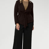 It can be worn open for a relaxed, effortless look, or cinched at the waist with its detachable tie belt for a more structured feel. Designed to sit just below the waist with a slightly longer front, the Lyndon Jacket complements both dresses and separates with ease.