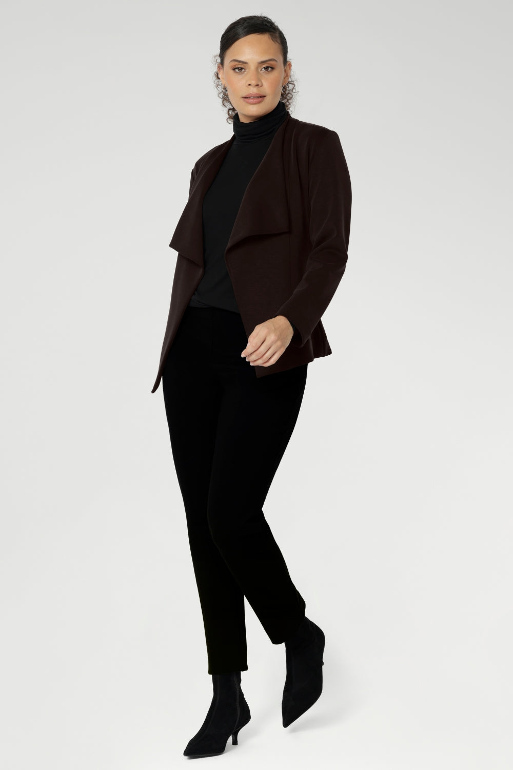 Australian made and thoughtfully designed for modern versatility. Crafted from a luxe Modal stretch fabric, this easy-care piece offers both warmth and elegance—perfect for layering during the cooler months. The Lyndon features a flattering wrap-style silhouette with angled front panels that drape beautifully, and tailored darts at the back to enhance shape.