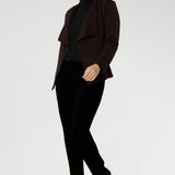 Australian made and thoughtfully designed for modern versatility. Crafted from a luxe Modal stretch fabric, this easy-care piece offers both warmth and elegance—perfect for layering during the cooler months. The Lyndon features a flattering wrap-style silhouette with angled front panels that drape beautifully, and tailored darts at the back to enhance shape.