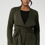 Crafted in a flattering wrap silhouette, this piece showcases double-layered, angled front panels for a contemporary touch. It includes a detachable waist tie and belt loops, giving you the option to wear it open or cinched to highlight your shape. Available in sizes 8 to 24.
