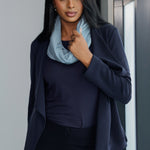 Crafted from soft Tencel wool blend in sky each scarf features a luxe double-layer construction in a closed-loop design that drapes beautifully, whether worn long and relaxed or styled with a cozy double wrap around the neck.