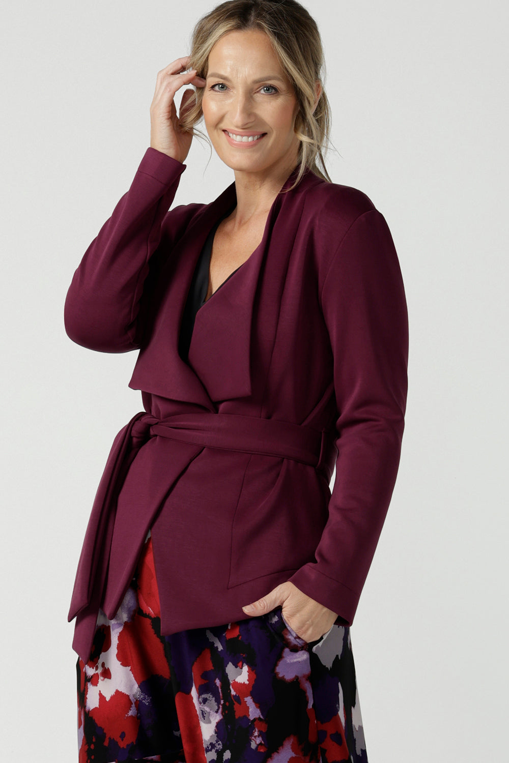Size 10 woman wears the Lyndon Jacket in Wine a made in Australia jacket in comfortable and easy care modal fabric. Made in Australia for women size 8 - 24. 
