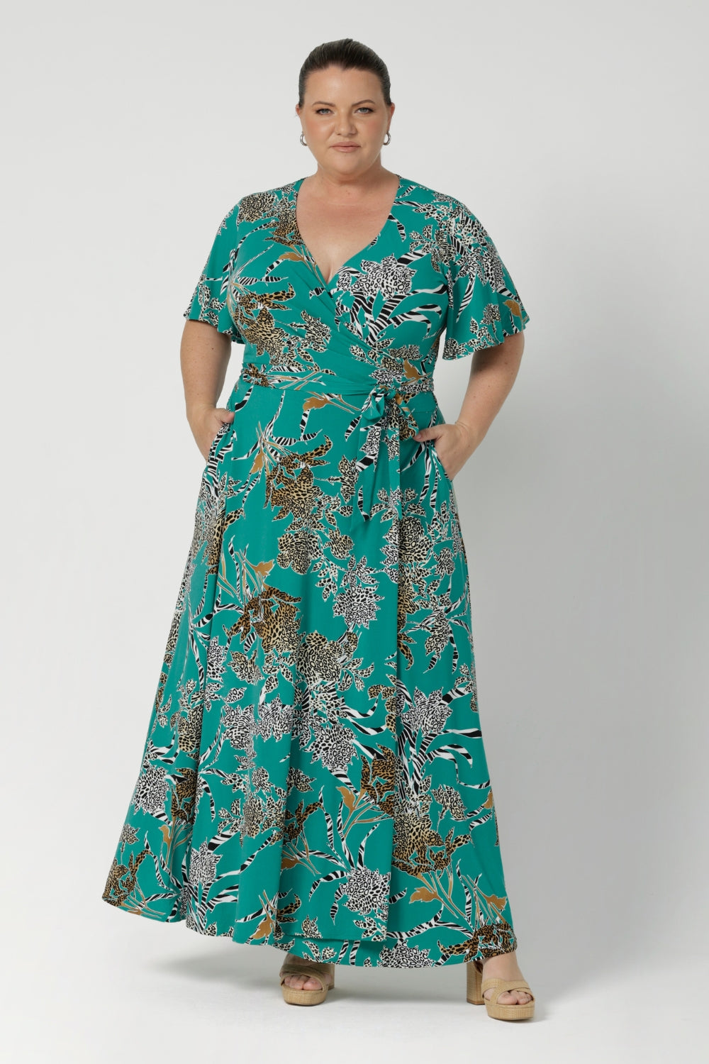 Maxi dress blends style and comfort, ideal for off duty summer events. Plus size model wears wrap dress made from dry touch jersey fabric - easy care and wrinkle resistant, perfect for packing. Maxi length dress available now in sizes 8-24.