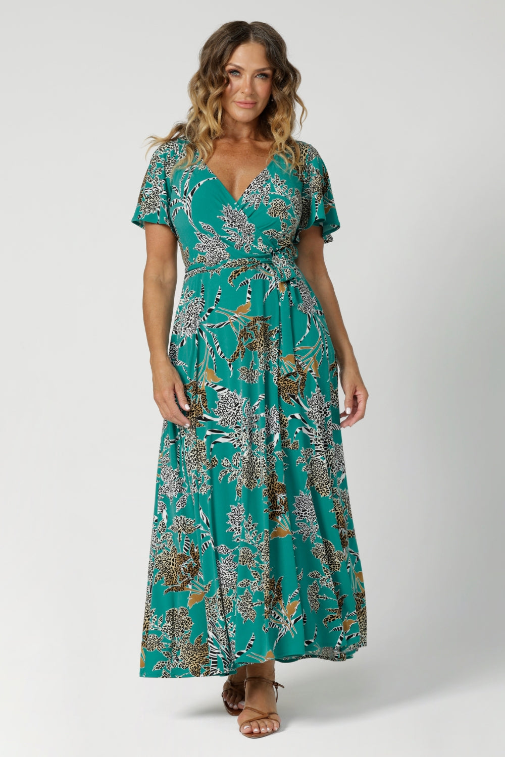 This women's summer maxi dress is the perfect blend of style and comfort, ideal for summer events. Made from a lightweight dry-touch jersey fabric, it features a rich jade colour with abstract animal print details. Available in sizes 8-24.