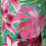 Fabric swatch of Malibu fabric crafted on slinky jersey fabric used by Australian and New Zealand women's clothing brand Leina & Fleur to make a collection of women’s wear dresses, tops and pants.

Malibu print is on a teal-blue slinky jersey base with print details in shades of green, pink, white, yellow and brown. The fabric has a soft stretch.