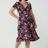 Size 10 woman wears a size 16 woman wears the Maree dress in Vivid Flora. Short sleeve functioning wrap dress. Knee length dress great for petite heights. Work corporate to weekend wear. Travel friendly. Made in Australia for women size 8 - 24.