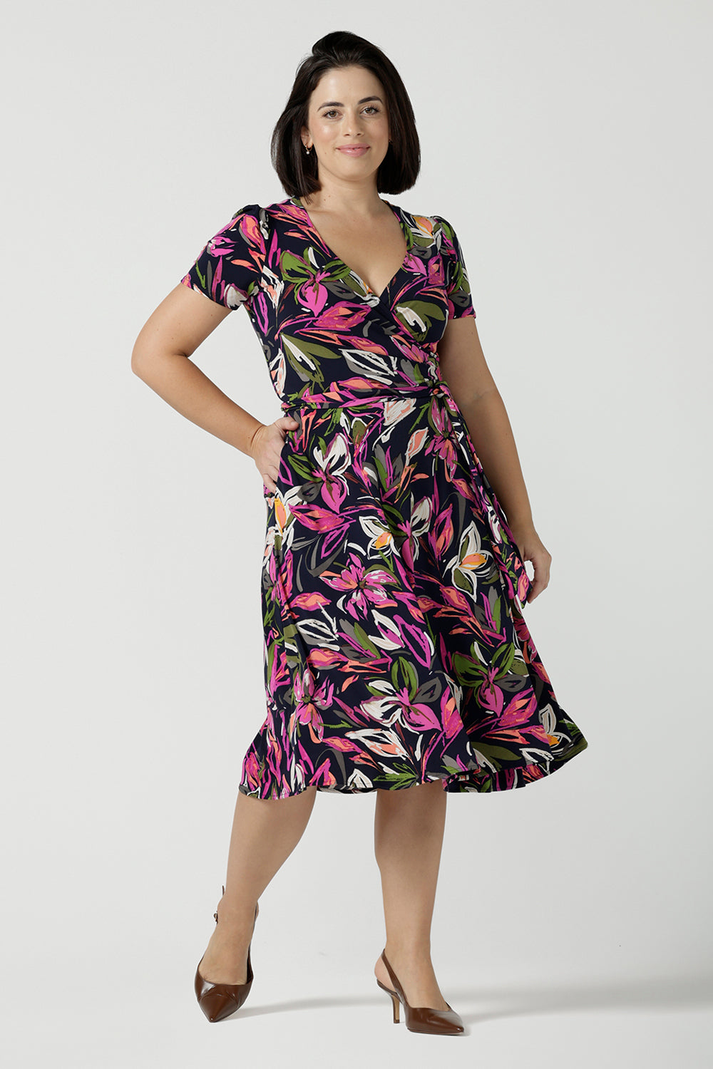 Size 10 woman wears a size 16 woman wears the Maree dress in Vivid Flora. Short sleeve functioning wrap dress. Knee length dress great for petite heights. Work corporate to weekend wear. Travel friendly. Made in Australia for women size 8 - 24.