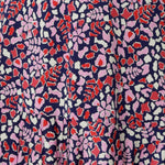 Fabric Swatch of a red, pink, and white abstract print on navy slinky jersey, used by Australian and New Zealand, women's fashion label, Leina & Fleur to make summer dresses and tops for women. 