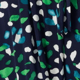 Fabric swatch of navy, green and white print dry touch jersey used to create a collection of workwear and wrap dresses for plus size and petite height women. All made in Australia by women's clothing brand, Leina & Fleur.