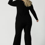 Back view of the Black Mason top in size 18. Made in Australia for women size 8 - 24. Long sleeve top made in easy care jersey. Made in Australia for women size 8 - 24. Styled bak with Brett pant in black.