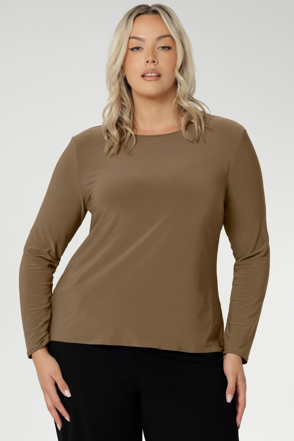 The Mason Top is a must-have addition to any woman’s wardrobe, offering timeless style and versatility for both workwear and casual looks. Proudly Australian made, this long-sleeved top is crafted from our signature easy care, wrinkle-resistant jersey fabric, making it the perfect low-maintenance option for everyday wear.