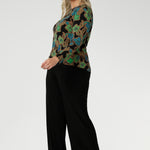 The long sleeves provide added warmth, while the straight hemline at the front and curved hemline at the back, which sits longer, give it a modern touch. 