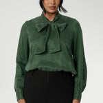 Crafted from suede touch Tencel that has a luxurious feel and drape. Proudly made in Australia in sizes 8-24. The Matisse Shirt in Deep Green is a pull-on style with a tie neckline, crafted from soft, fluid fabric. Blouson sleeves and buttoned cuffs add a polished finish. Matisse is a semi-fitted pull on style V-neckline shirt with extended neck ties, back pleats and bishop sleeves.