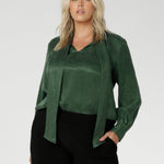 Crafted from suede touch Tencel that has a luxurious feel and drape. Proudly made in Australia in sizes 8-24. The Matisse Shirt in Deep Green is a pull-on style with a tie neckline, crafted from soft, fluid fabric. Blouson sleeves and buttoned cuffs add a polished finish. Matisse is a semi-fitted pull on style V-neckline shirt with extended neck ties, back pleats and bishop sleeves.