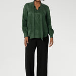 Crafted from suede touch Tencel that has a luxurious feel and drape. Proudly made in Australia in sizes 8-24. The Matisse Shirt in Deep Green is a pull-on style with a tie neckline, crafted from soft, fluid fabric. Blouson sleeves and buttoned cuffs add a polished finish. Matisse is a semi-fitted pull on style V-neckline shirt with extended neck ties, back pleats and bishop sleeves.
