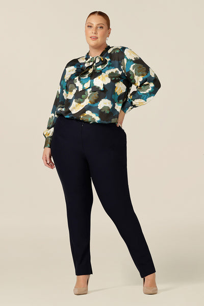A luxe pull-on shirt in abstract floral print, the Matisse Shirt in Pom Pom has a V-neckline with pussy bow neck ties and long, bishop sleeves that blouson over fitted cuffs. Worn with slim leg navy pants as an elegant going-out shirt.