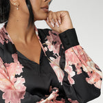 The Matisse Shirt brings timeless romance to your wardrobe. Size 10 woman wears floral blouse tucked into her straight leg pants. 