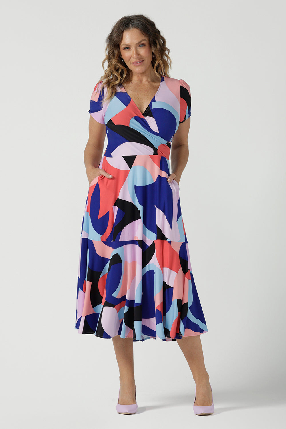 The Mavi Dress in Amalfi is a fixed wrap dress in midi length. A abstract print with a short sleeve. Based on our best selling Bettina dress, this style is great to take you from desk to dinner. Petite to plus size women size 8-24.