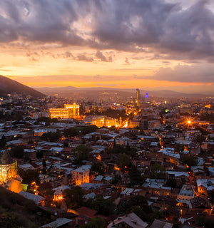 Scenic view of Europe at dusk, visited by L&F customer, Susan on an overseas trip where she showcases how L&F clothing works well for 40 plus women looking for a long haul, capsule travel wardrobe.