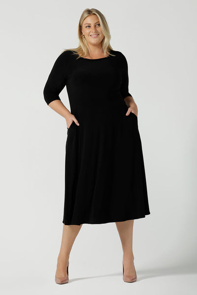 Size 18 woman wears the Melissa dress in black, a belted style with pockets and 3/4 sleeve with rounded boat neckline. Petite to plus size fashion made in Australia for women size 8 - 24. 